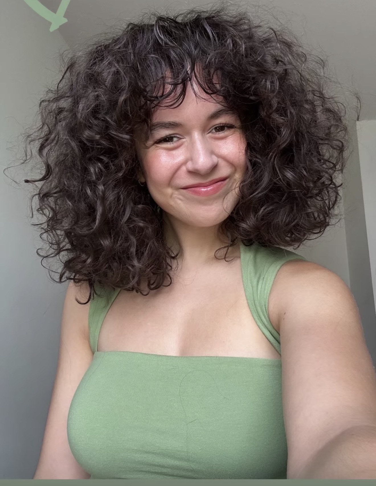 Candid smiling portrait of Josie Altucher in a green top